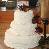My First Wedding Cake My first wedding cake. The cake did not like the 2 1/2 hour car ride in the mountains, but I think in all it looks ok... (i think cakes get...