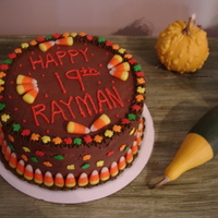 Autumn Birthday Cake Marble Cake with chocolate pudding filling and chocolate buttercream frosting. Decorated with candy corns and fall leaf sprinkles.