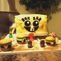 Spongebob Carved cake covered in fondant with fondant plankton and gary also cupcake krabby patties.TFL!!!