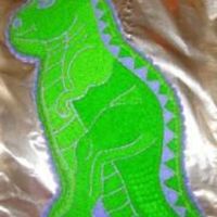 Dinosaur Of A Birthday Made for William's 5th birthday. Yellow cake with Green and lavendar buttercream icing.