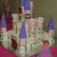 Princess Castle Cake Fondant walls and towers using ice-cream cones. Double layer 10" cake and 6" cakes.