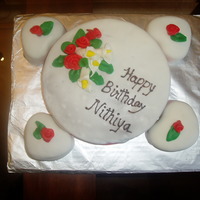 Calla Lillies And Ribbon Roses Chocolate cake with chocolate filling. Fondant calla lilies and ribbon roses.