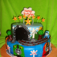 Thomas The Train This was a 14" yellow cake with strawberry filling (play on strawberry shortcake) and 10" chocolate with chocolate ganache. MMF...