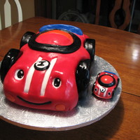 Lil Zoomer Car Cake For my sons 1st birthday. His favorite toy. Fisher Price Lil Zoomer. Used 3 9x13 cakes carved. Fondant. Used all Duff brand but top layer...