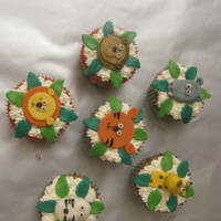 Animal Cupcakes.... carrot cupcakes with buttercream icing and fondant accents....original design by sourkastic.......