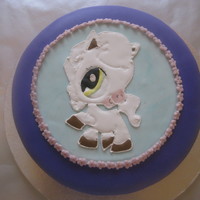 Happy New Year!! wasc pineapple cake with buttercream icing and covered with MFF fondant...fondant plaque with royal icing figure.......this cake is a...