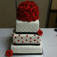 Red Rose Wedding Top two layers red velvet with cream cheese filling, bottome layer WASC with raspberry mouse filling. All coverd in fondant with red...