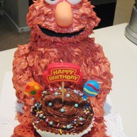Elmo Loves Chocolate Buttercream! My son's 2nd birthday cake. Elmo's body is out of cake and his head and arms and legs are rice krispie treats...