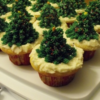 Christmas Tree Cupcakes Baked cupcakes, while still warm I pressed a shotglass into the center to make a shallow hole. Then placed a cone-shaped cake ball into...