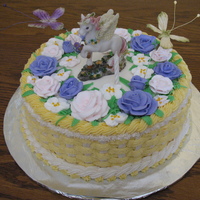 Unicorn In The Fowers This is what my DD wanted...a unicorn in the flowers. Porcelain unicorn, royal icing flowers, silk butterflies dancing in a bc basket.