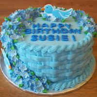 Blue Birthday Basket Cake My Aunt wanted an all blue cake for her birthday. 8" white cake with raspberry filling iced in almond buttercream. Side buttercream is...