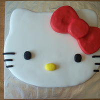 Hello Kitty Death by chocolate cake with Vanilla buttercream covered in MMF . Bow is RKT iced in buttercream and covered in MMF. All Black is Choco-Pan...