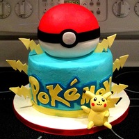 Pokemon I made the little yellow guy out of a mix of fondant & gumpaste.The top ball cake is covered in fondant, the bottom is buttercream with...