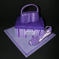 Purple Shoebox With Gumpaste Shoe And Handbag A purple shoebox with gumpaste shoe and handbag. I learned so much! I hope that I get the opportunity to do another one similar.