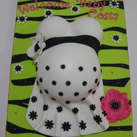 Pregnant Belly Cake 2 This was made for my friends baby shower and the mom-to-be doesn`t know what she`s having. Thats why I kind of mixed the green and pink...