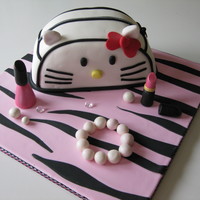 Hello Kitty Cake I took a class with Andrea Sullivan from Sweet Cakers and she was teaching everyone to do a Coco chanel purse with lipstick &...