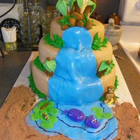 Jungle Baby This was 3 tier strawberry cake decorated with fondant. All decorations are fondant except for the grass which was buttercream, and the...