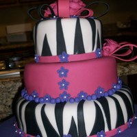 Zebra Zebra print cake. strawberry cake with strawberry cream filling. Red Velvet with Raspberry cream fillin.