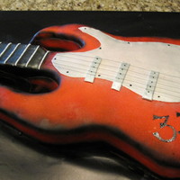 Rock 'n' Roll WASC cake covered in fondant. Neck of guitar is RCT. Very fun cake to make!