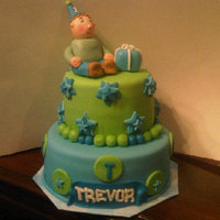 Trevor's First Birthday My third cake to make and first time making a fondant figure. Cake was made for my cousin son's first birthday.