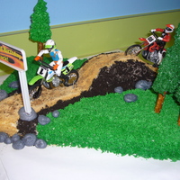 Motorcycles On A Dirt Track I made this cake for my sons 3rd birthday. For the dark dirt I used crushed oreo cookies, and for the light colored dirt I used graham...