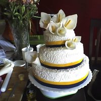 Lilly Cake This is my first wedding cake. Its all buttercream with fondant ribbon. The cake is slightly angled (that's the way the groom wanted...