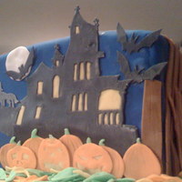 Hallow's Eve Cake- Mouuuuuha-Ha-Ha-Ha My first cake made without a mould, and with little hand made bonhommes. This is four layers of white cake separated by a chocolate...