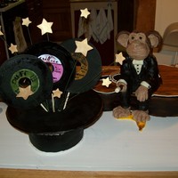 Magic Monkey Records Cake The monkey and hat are made of Rice crispy treats covered in modeling chocolate and the records and stars are of gumpaste.