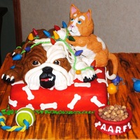 Bulldog And Kitten I made this cake for a fund raiser to benefit a local animal shelter. All the decorations are edible.
