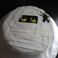 Boo!! This was soooo easy and fun to make!! It's a almond vanilla cake with orange butter cream filling and frosting. I used vanilla fondant...