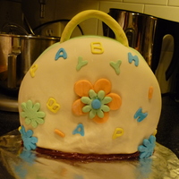 My First Purse! This is my very first ever purse cake that was SOLD..woohoo!! I have not sold any of my cakes yet and a neighbor trusted me to make her...