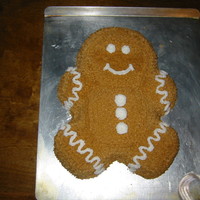 Gingerbread Man Choc cake with peanut butter buttercream frosting, details in white BC. Used teddy bear pan, trimmed off the ears