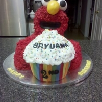 Elmo Elmo's head is RKT. His body is cake. Cupcake is chocolate cake with buttercream icing and fondant