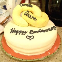 Intertwined Rings So I made this for my mom & dad's anniversary, It's my first covered in fondant cake (My fingers were crossed the entire time...