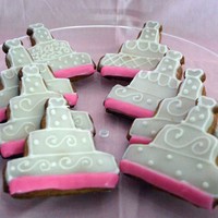 Wedding Cake Cookies These cookies were created for a client. They are a butter cookie with a Vanilla Icing. All details are done in the Vanilla Icing.