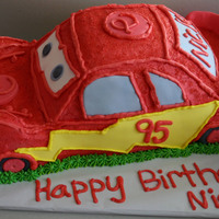 Lighting Mcqueen This cake was carved out of sveral layers of cakecovered in buttercream and decorated with fondant accents.