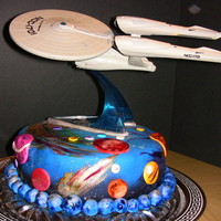 Star Trek Birthday Cake This was my 3rd fondant covered cake. The planets are airbrushed and hand painted as well is the cake it's self. And the little "...