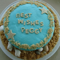 Beach Bridal Shower Buttercream icing, MMF for letters and starfish, brown sugar for sand and real seashells.