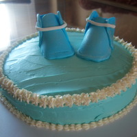 Blue Booties Orange flavored cake with buttercream icing. The booties are gumpaste