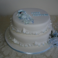 Baby Boy Christening/baby Shower Cake This two tiered cake makes a great cake for a Christening or Baby Shower. The baby and the lettering are made from gum paste. The garrett...