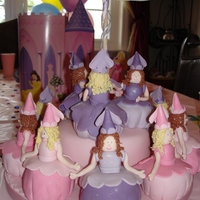 Dancing Princess Cake I just loved making this cake. It was so fun! Each princess is a cupcake. Three princesses are on the top of a 6" cake and are dancing...