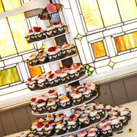 Fall Wedding Cupcakes Wedding cupcakes with fall colored fondant flowers on each one adorned with brown cardstock cupcake wrappers