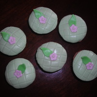 Fondant Cupcakes fondant covered mini dark chocolate cupcakes (with a laryer of dark chocolate buttercream). Fondant flowers