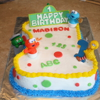 123 Sesame Street For a 1st birthday. White cake with white buttercream icing. Big Bird, Baby Elmo & Cookie Monster, Oscar the Grouch and his friend...