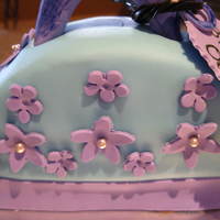 Flower Purse Cake Double chocolate cake with white chocolate fondant & gumpaste flowers.All for a very special 7 yr old :)
