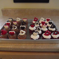 Valentine Cupcakes .Red velvet with caramel filling and cream cheese frosting. Yellow golden cake with fudge filling and chocolate cream frosting. All topped...