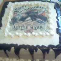 Rooster B-Day Cake This was a french vaniila cake with cookies & cream filling. Iced with regular buttercream. I cheated & melted chocolate frosting...