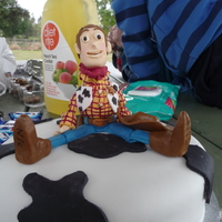 Toy Story So this cake is for my nephews 4th bday.The cake is a 8inch mudcake with chocolate ganache.The Woody figure is made entirely out of...