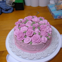 Mother's Day Cake I made this cake for my mom, based on a Wilton design. The roses are all royal icing, and everything else is buttercream.