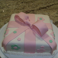 Pink Cake Box This wasn't my first fondant cake, but it was the first gift box cake. Made it for my sister in-law. Thanks for looking :)